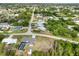 Aerial of property with pool and adjacent wooded area at 7180 Quarry St, Englewood, FL 34224