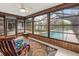 Inviting Florida room with screens offering a view of the sparkling swimming pool at 7180 Quarry St, Englewood, FL 34224