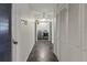 Hallway with tile flooring leading to the laundry room at 7180 Quarry St, Englewood, FL 34224