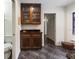 Stylish kitchen featuring a wet bar and a view of the hallway at 7180 Quarry St, Englewood, FL 34224
