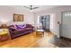 Cozy living room featuring hardwood floors, comfortable furniture, and natural light at 7180 Quarry St, Englewood, FL 34224