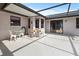 Covered patio with tile trim and seating at 7180 Quarry St, Englewood, FL 34224