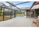 Spacious, screened-in pool area with ample patio space for outdoor seating and relaxation at 7180 Quarry St, Englewood, FL 34224