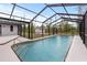Sparkling pool with screened enclosure and patio at 7180 Quarry St, Englewood, FL 34224