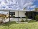 This home has a large back patio and a screened-in porch for enjoying the outdoors at 786 Heathercreek Ct, Englewood, FL 34223