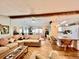 Open concept living room featuring wood floors, modern decor, and a spacious seating area perfect for entertaining guests at 786 Heathercreek Ct, Englewood, FL 34223