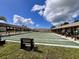 Community shuffleboard courts with covered seating areas, perfect for outdoor recreation at 786 Heathercreek Ct, Englewood, FL 34223