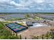 Community featuring lake, clubhouse, pool and pickle ball courts at 8244 Shore Lake Dr, Englewood, FL 34224