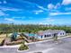 This aerial photo highlights the community's pool, playground, and recreation center at 8244 Shore Lake Dr, Englewood, FL 34224