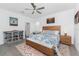 Spacious bedroom with ample lighting, stylish rug, and contemporary furniture at 8244 Shore Lake Dr, Englewood, FL 34224