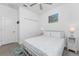 Comfortable bedroom featuring a closet, ceiling fan, and accent lighting at 8244 Shore Lake Dr, Englewood, FL 34224