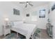 Cozy bedroom with light colored walls and marine-themed décor at 8244 Shore Lake Dr, Englewood, FL 34224