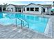 Resort-style community pool with clear blue water and inviting lounge area for residents at 8244 Shore Lake Dr, Englewood, FL 34224
