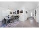Dining room with table, decorative bike console and decor, and entrance view at 8244 Shore Lake Dr, Englewood, FL 34224