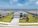 Beautiful one-story home with waterfront views, manicured lawn, and paved driveway at 8244 Shore Lake Dr, Englewood, FL 34224