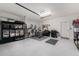 Two car garage with epoxy floor and ample storage at 8244 Shore Lake Dr, Englewood, FL 34224
