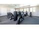 The on-site gym features modern exercise equipment and plenty of natural light at 8244 Shore Lake Dr, Englewood, FL 34224