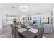 Open-concept living room flowing into a modern kitchen and waterfront view at 8244 Shore Lake Dr, Englewood, FL 34224