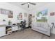 Bright home office boasts hardwood floors, a modern ceiling fan, and work space at 8244 Shore Lake Dr, Englewood, FL 34224