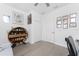 A home office featuring decorative shelving, hard wood floors, and ample storage at 8244 Shore Lake Dr, Englewood, FL 34224