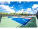A community sports area features pickleball courts bordered by a secure fence at 8244 Shore Lake Dr, Englewood, FL 34224