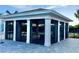 Modern pool cabana featuring open-air design, perfect for relaxation and entertaining at 8244 Shore Lake Dr, Englewood, FL 34224