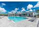 A stunning community pool is nestled by a gazebo and the clubhouse at 8244 Shore Lake Dr, Englewood, FL 34224