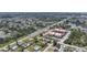 Captivating aerial perspective of a quaint neighborhood near a main road and serene lake, property pinpointed at 857 Palmetto St, Englewood, FL 34223