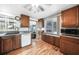 Functional kitchen with ample cabinetry, hardwood floors, and abundant natural light at 857 Palmetto St, Englewood, FL 34223
