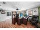 Office area featuring hardwood floors, great light, and desk space at 857 Palmetto St, Englewood, FL 34223