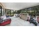 Covered back patio with a grill, seating, and ample space for outdoor gatherings at 857 Palmetto St, Englewood, FL 34223