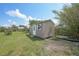 Backyard featuring a small storage shed painted in a neutral tone at 857 Palmetto St, Englewood, FL 34223