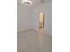Bedroom featuring tile floors with an ensuite bathroom with tiled shower and vanity at 8661 Seasalt Loop, Englewood, FL 34224