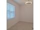 Cozy bedroom features tile floors and a bright window at 8661 Seasalt Loop, Englewood, FL 34224