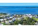 Expansive aerial view showcases waterfront homes and the scenic beauty of the ocean and surrounding coastline at 868 Harvard St, Englewood, FL 34223