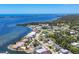 Stunning aerial view of waterfront homes on the coast, seamlessly blending residential living with breathtaking ocean views at 868 Harvard St, Englewood, FL 34223