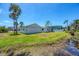 Backyard view with lush greenery and waterfront access, ideal for nature lovers at 868 Harvard St, Englewood, FL 34223