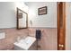 Bathroom featuring pink tiling, a classic vanity, and stylish fixtures at 868 Harvard St, Englewood, FL 34223