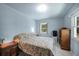 Well-lit bedroom with neutral colored walls and two windows providing lots of natural light at 868 Harvard St, Englewood, FL 34223