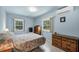 Comfortable bedroom with neutral walls, two windows providing natural light at 868 Harvard St, Englewood, FL 34223