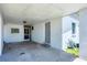 Covered parking area featuring access to the main home and an exterior door at 868 Harvard St, Englewood, FL 34223
