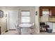 Dining room showcasing a white table, four chairs, and natural light through the window at 868 Harvard St, Englewood, FL 34223