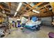 A garage with great lighting holds a boat on a trailer, as well as workbench and tools at 868 Harvard St, Englewood, FL 34223