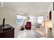 Cozy living room featuring two chairs, a TV, and neutral paint tones at 868 Harvard St, Englewood, FL 34223