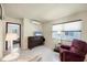 Comfortable living room with tile flooring, lots of natural light and neutral paint tones at 868 Harvard St, Englewood, FL 34223