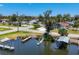 Scenic view of waterfront homes with docks, boat lifts, and lush landscaping, perfect for boating and enjoying the coastal lifestyle at 868 Harvard St, Englewood, FL 34223