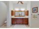 Bathroom features a modern vanity with double sinks and framed mirror at 9144 Spring Valley Rd, Englewood, FL 34224