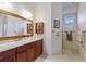 Modern bathroom features a large vanity with plenty of cabinet space at 9144 Spring Valley Rd, Englewood, FL 34224