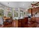 Gourmet kitchen boasts a center island, granite countertops, custom cabinets, and a breakfast nook at 9144 Spring Valley Rd, Englewood, FL 34224