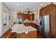 Well-equipped kitchen with custom cabinets, stainless steel appliances, and ample counter space at 9144 Spring Valley Rd, Englewood, FL 34224